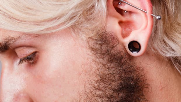 person with industrial bar piercing