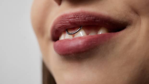 woman with an oral piercing.